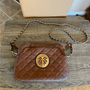 Brown crossbody handbag with gold floral tree metal pattern